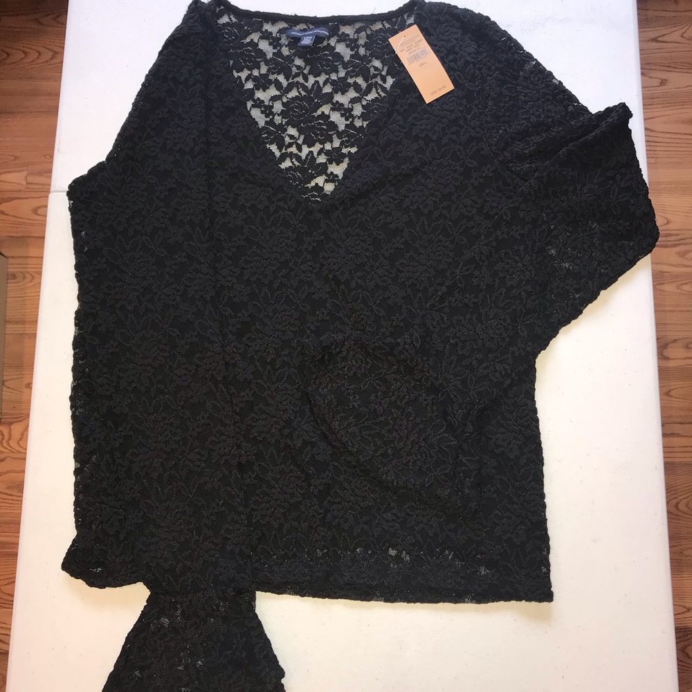 Black long sleeved flared cuff top